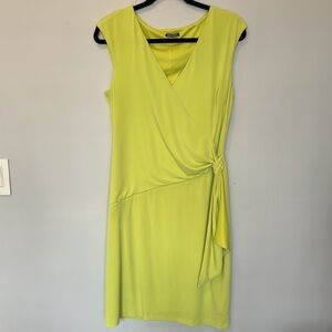 Faux wrap dress in lime green. Lined with side toe detail. Size 12.